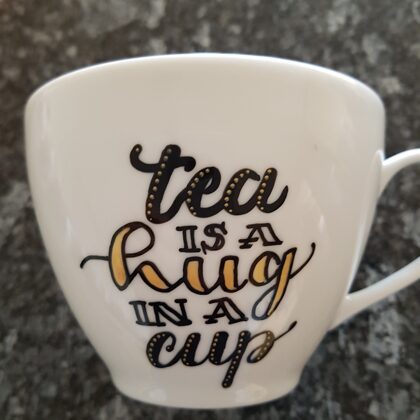 L - tea is a hug in a cup