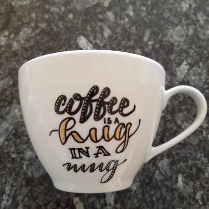 L - coffee is a hug in a mug