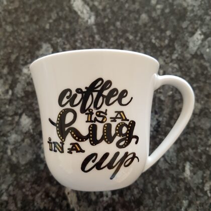 L - coffee is a hug in a cup
