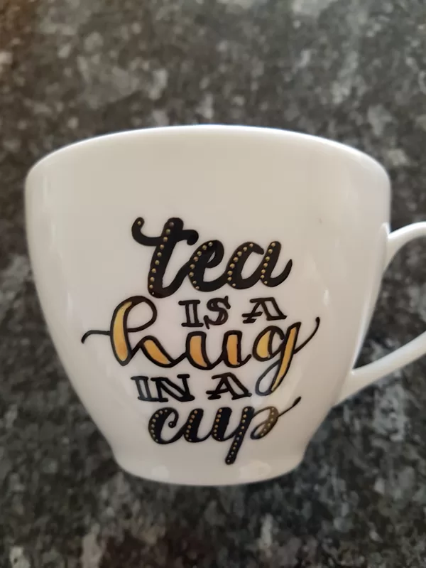 L - tea is a hug in a cup