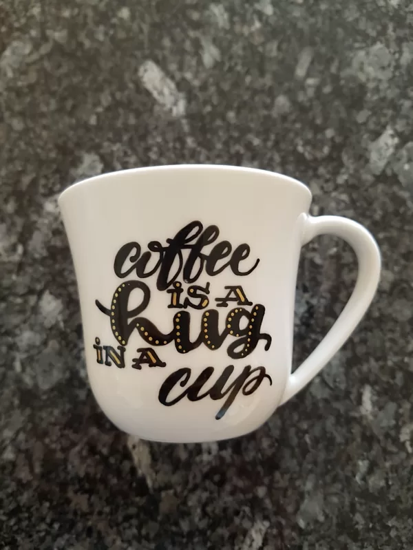 L - Coffee is a hug in a cup
